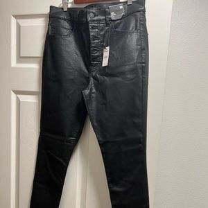 Coated black ankle jeans